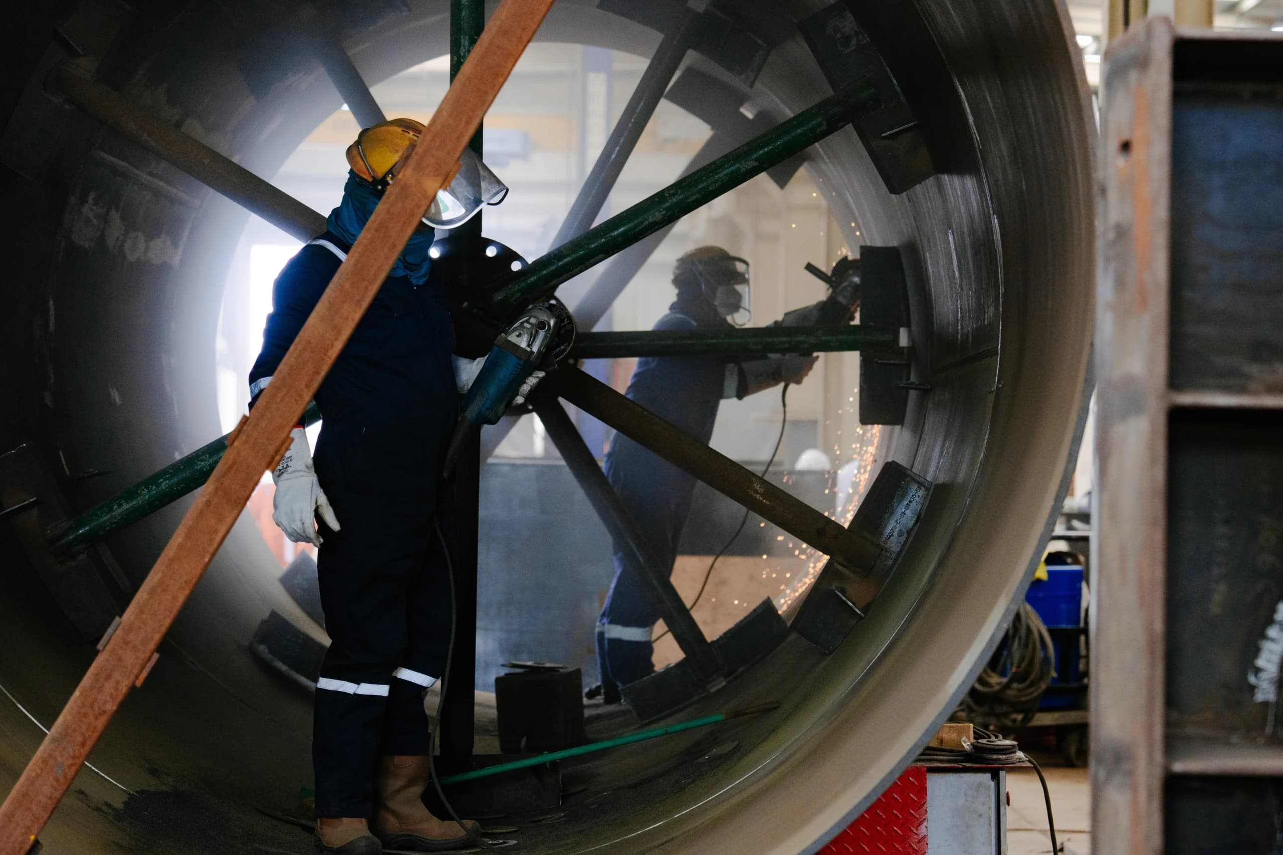 Dolphin Group technicians working inside a large pressure vessel